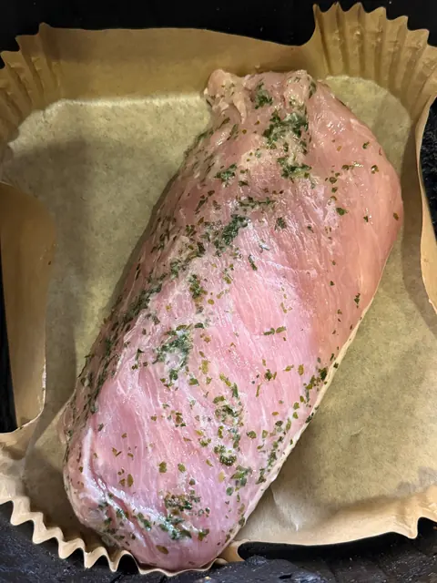The marinated pork loin in the air fryer, ready to cook