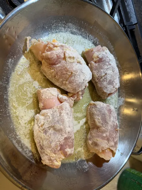 Browning the bundles in butter in a large skillet
