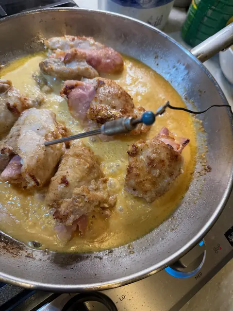Checking the thickest piece with an instant-read thermometer