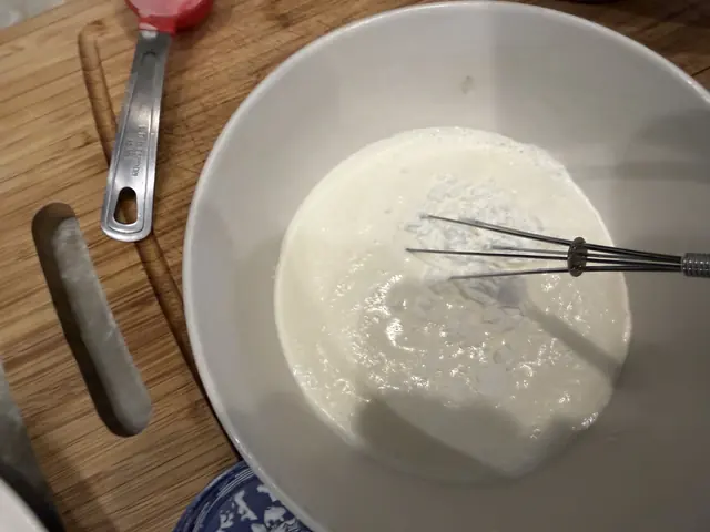 Whisking the cornstarch into the cream