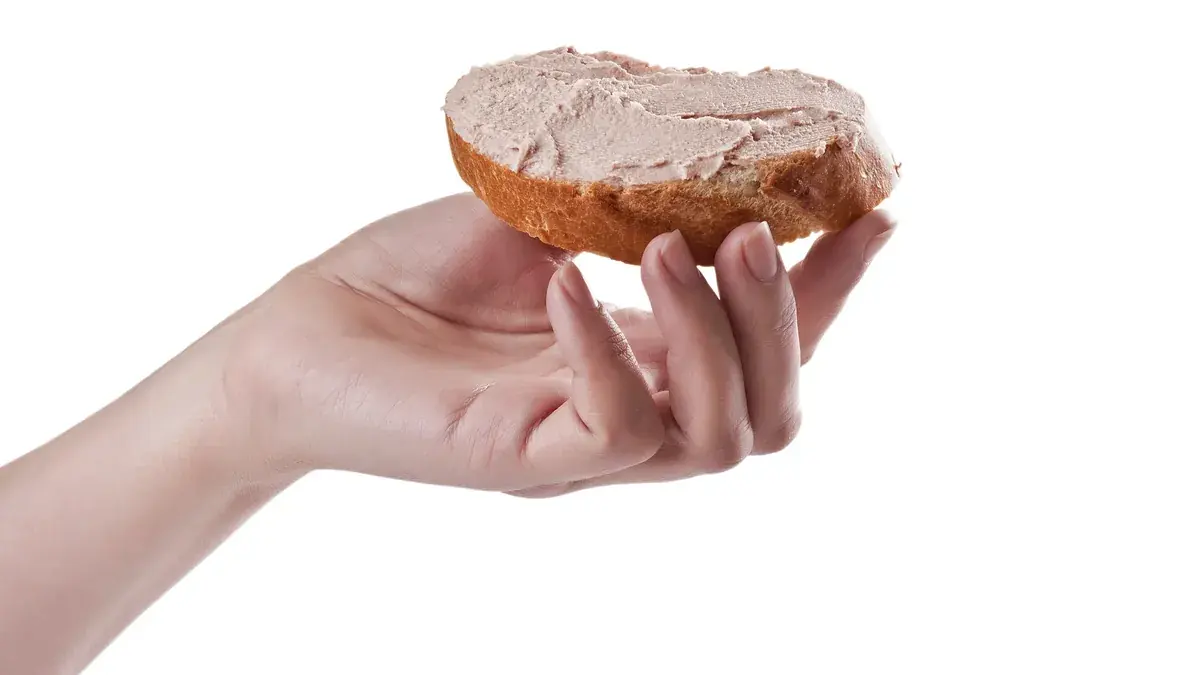 Chopped liver spread on a slice of bread