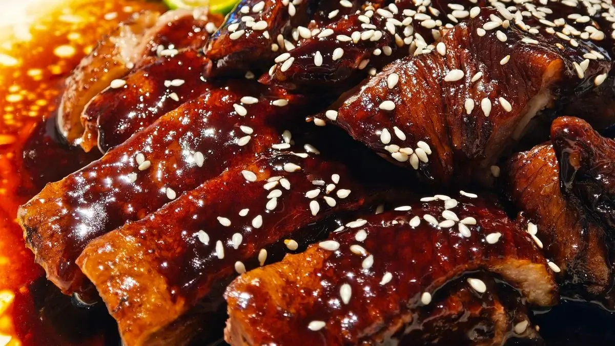 Sticky glazed pork ribs with sesame seeds