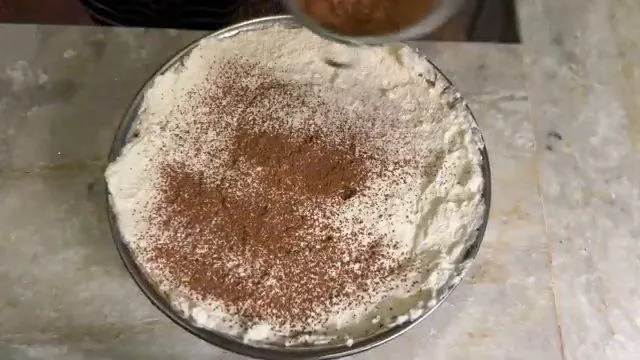 Dusting the top with cocoa powder
