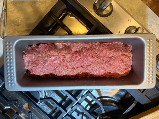 Meat loaf mixture pressed into a loaf pan